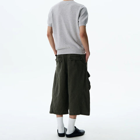 A PUEE American retro cleanfit multi pocket workwear shorts for men and women on the street, loose and versatile cropped pants for summer
